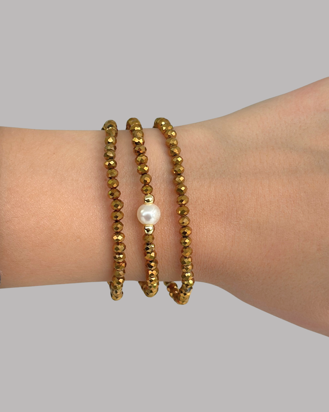 SET PULSERAS DE CRISTALES DORADOS Y PERLA