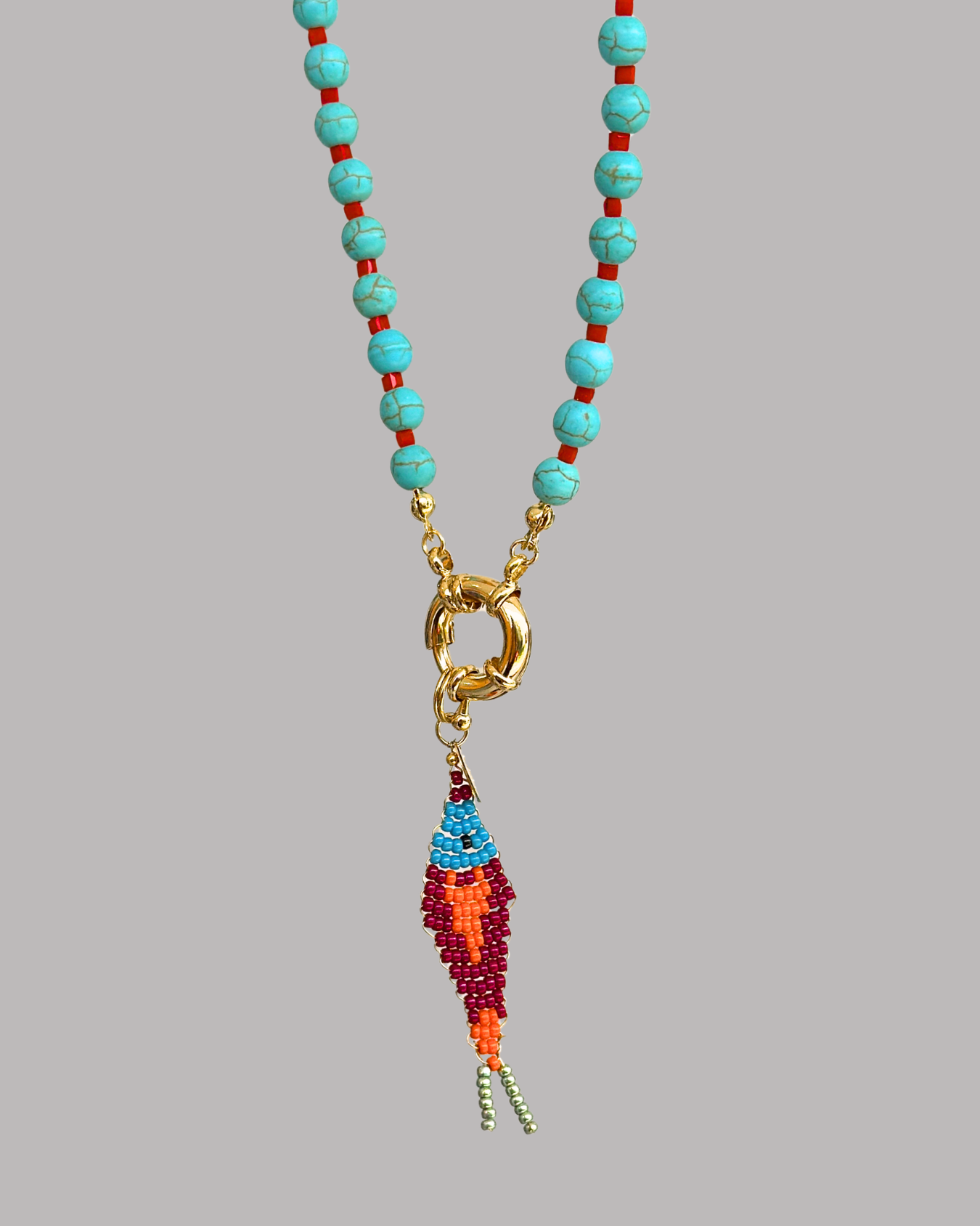 COLLAR LARGO DE TURQUESAS Y PEZ