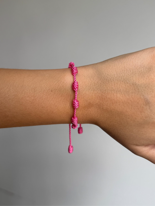 PULSERA SIETE NUDOS FUSIA