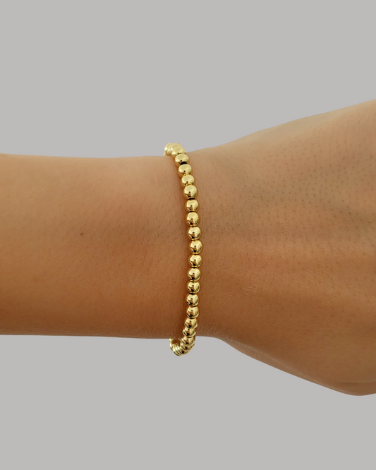 PULSERA DE BALINES DORADOS PEQUEÑOS