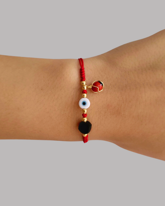 PULSERA HILO OJO TURCO, AZABACHE Y PIONíA